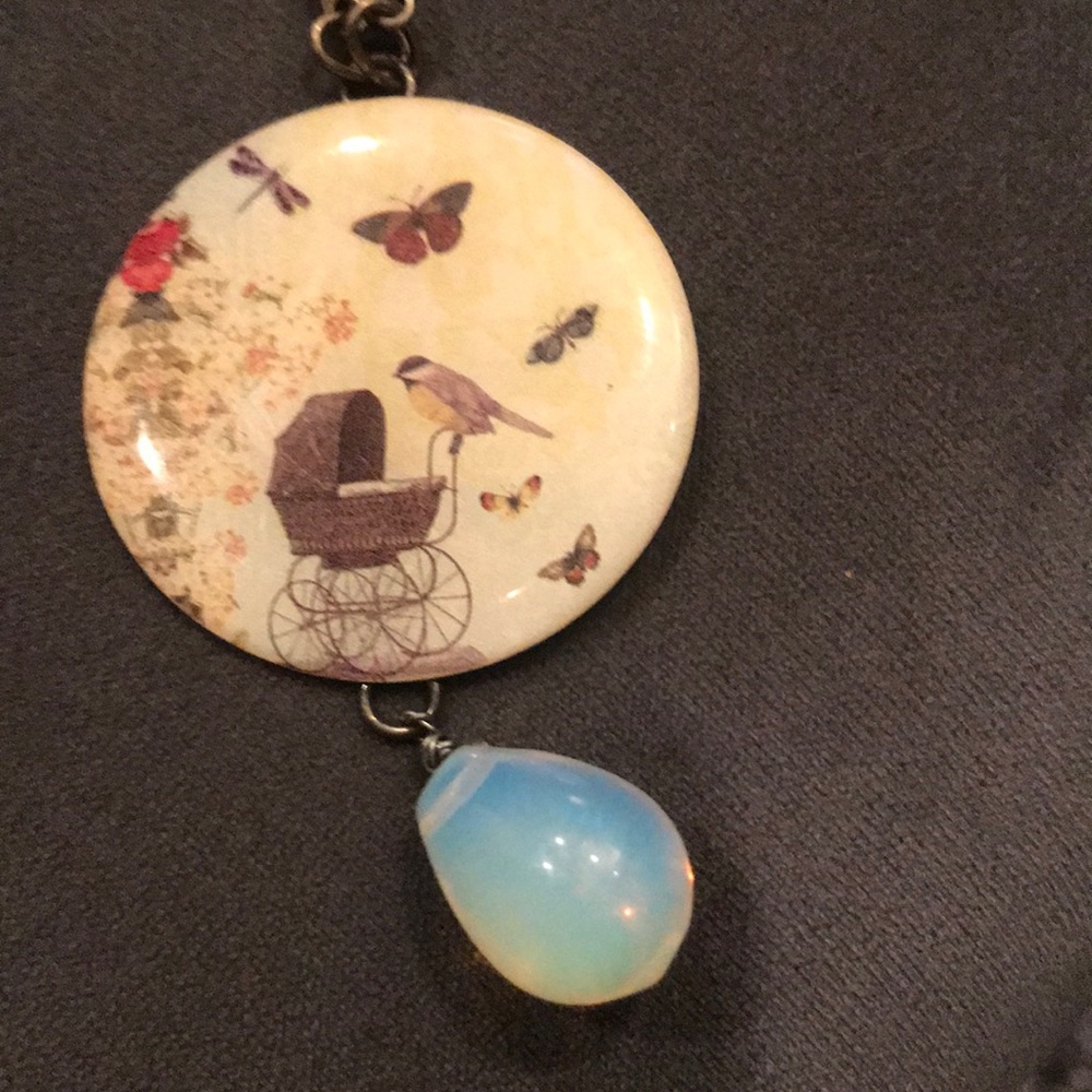 17 inch necklace with baby buggy detail.